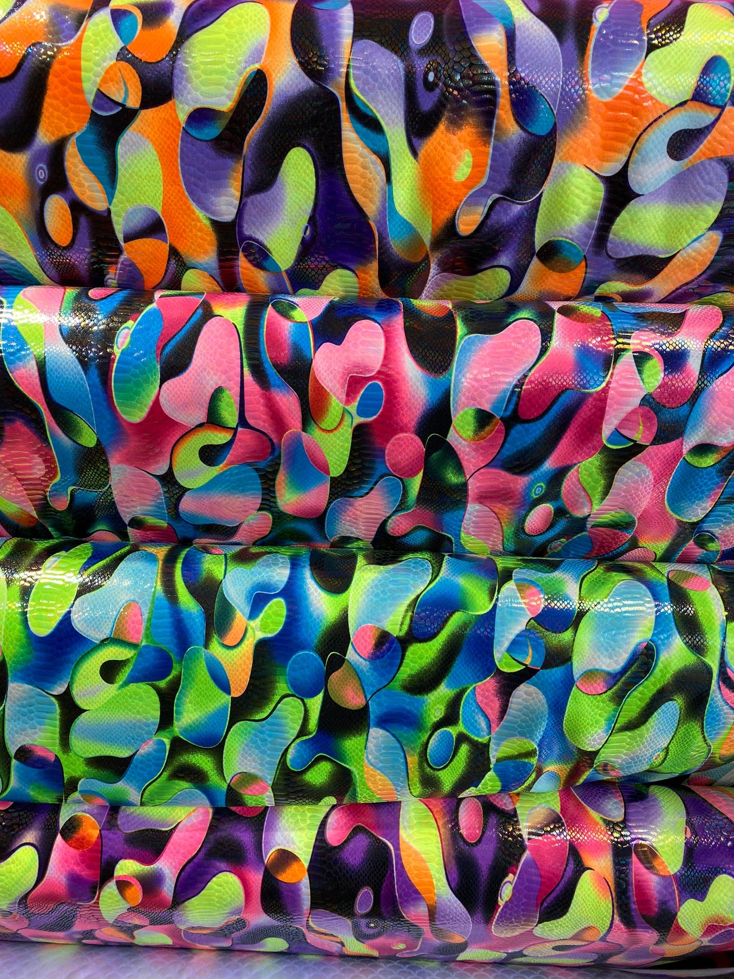 Anaconda snake design print on nylon spandex with iridescent clear foil UV light neon colors it glows in the dark 4-way stretch 58/60” Wide