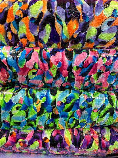 Anaconda snake design print on nylon spandex with iridescent clear foil UV light neon colors it glows in the dark 4-way stretch 58/60” Wide