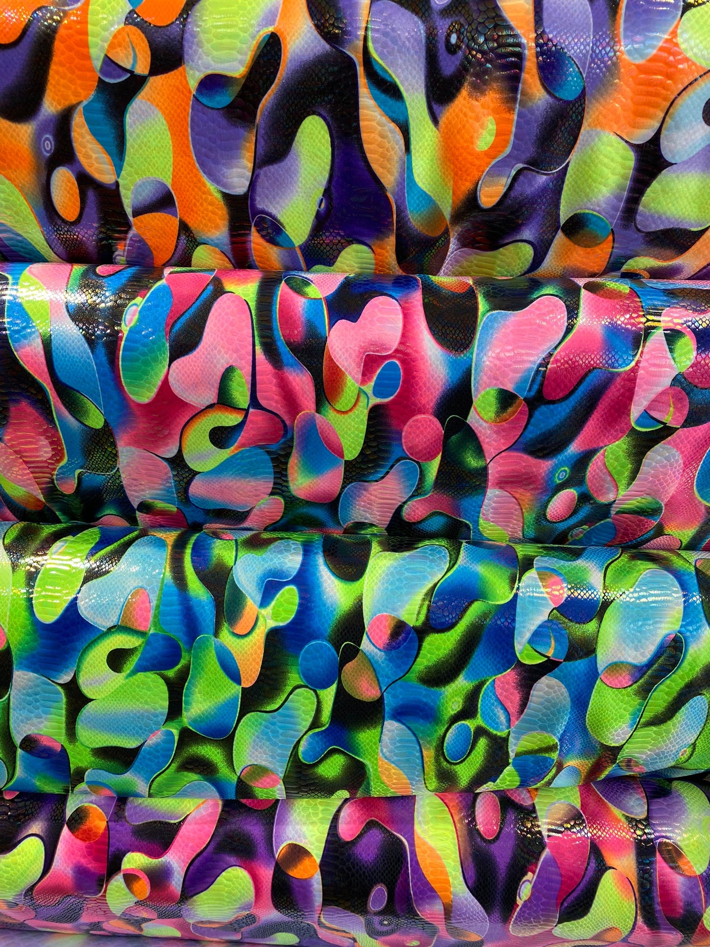 Anaconda snake design print on nylon spandex with iridescent clear foil UV light neon colors it glows in the dark 4-way stretch 58/60” Wide