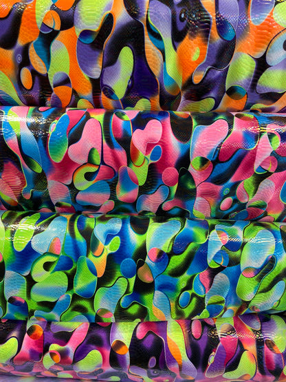 Anaconda snake design print on nylon spandex with iridescent clear foil UV light neon colors it glows in the dark 4-way stretch 58/60” Wide