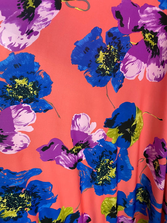 New big flower design coral/sapphire/magenta color print on poly spandex medium weight 58/60” Sold by the YD. Ships worldwide from L.A CA.