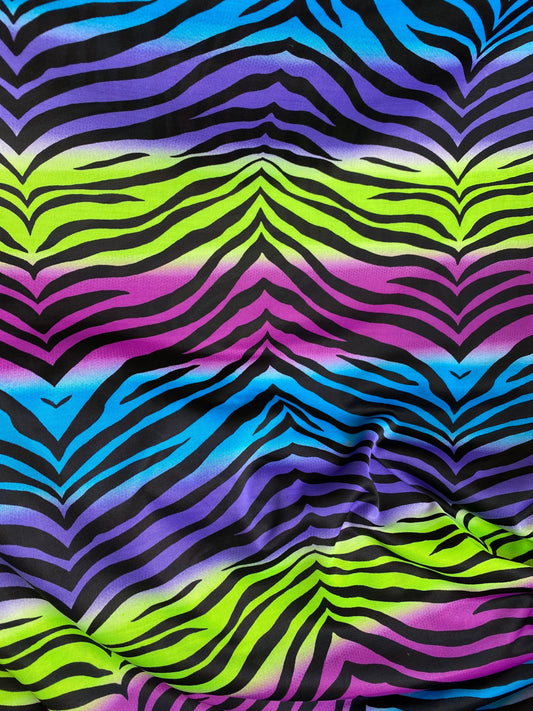 New zebra design rainbow neon green multi poly spandex 4-way stretch medium weight 58/60” Sold by the YD. Ships worldwide from Los Angeles