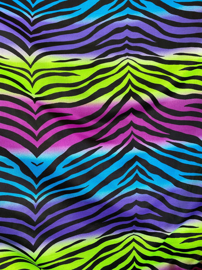 New zebra design rainbow neon green multi poly spandex 4-way stretch medium weight 58/60” Sold by the YD. Ships worldwide from Los Angeles