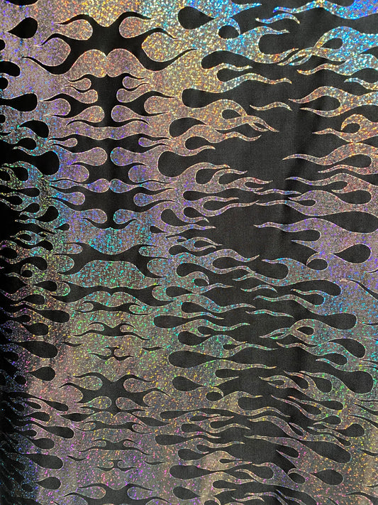 New hologram flames design metallic poly spandex black/silver 2-way stretch 58/60” Sold by the YD. Ships worldwide from Los Angeles CA USA.