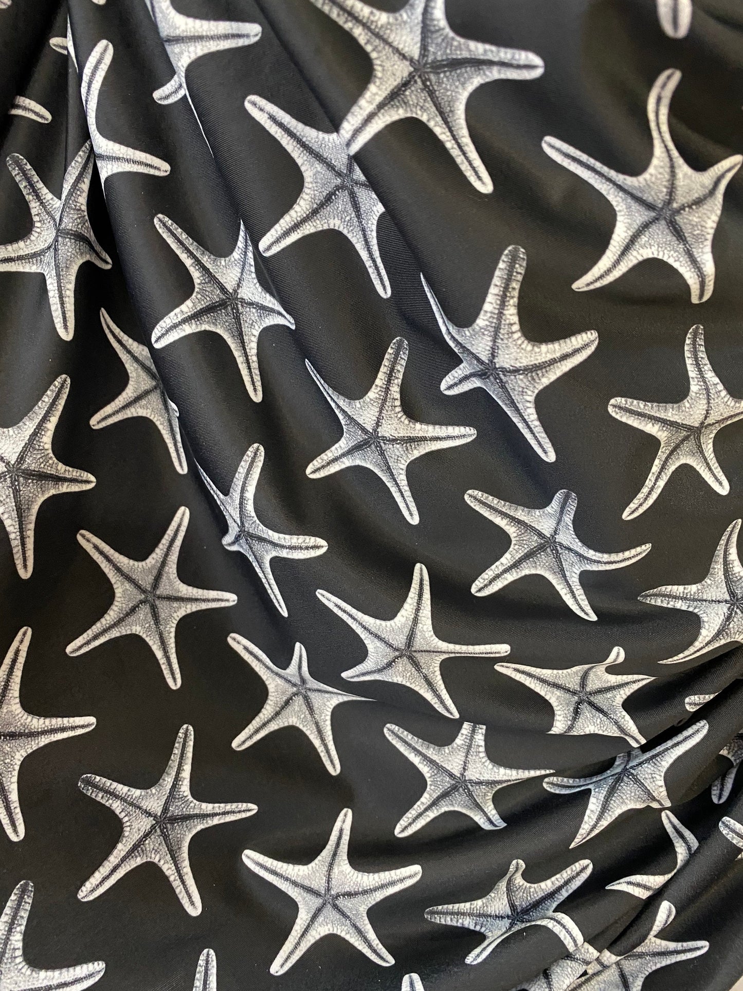 New starfish design print on nylon spandex 4-way stretch 58/60” Sold by the YD. Ships worldwide from Los Angeles California USA.