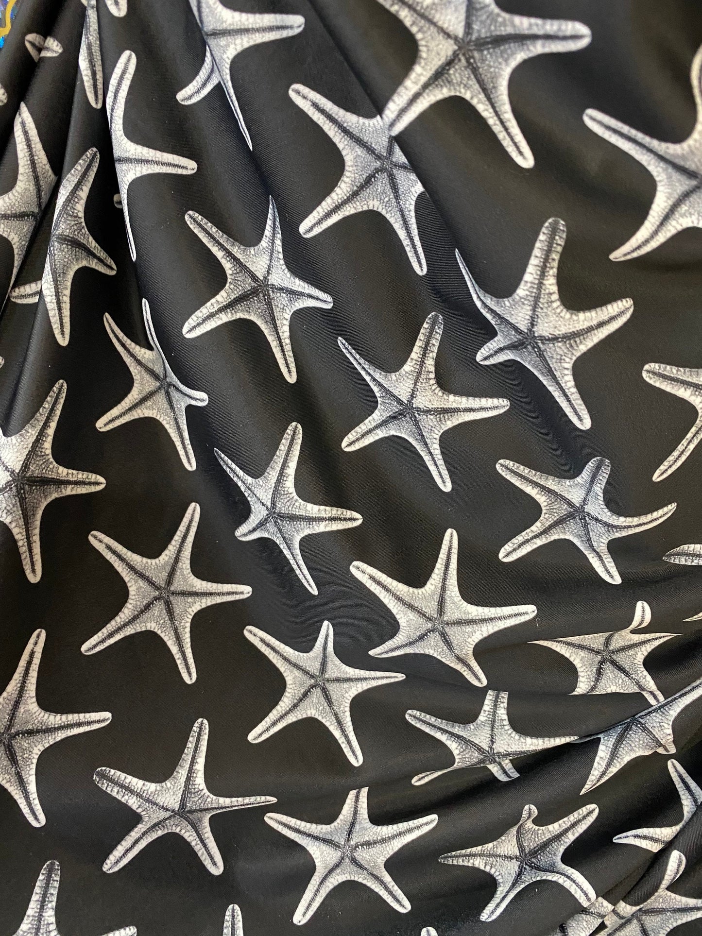 New starfish design print on nylon spandex 4-way stretch 58/60” Sold by the YD. Ships worldwide from Los Angeles California USA.