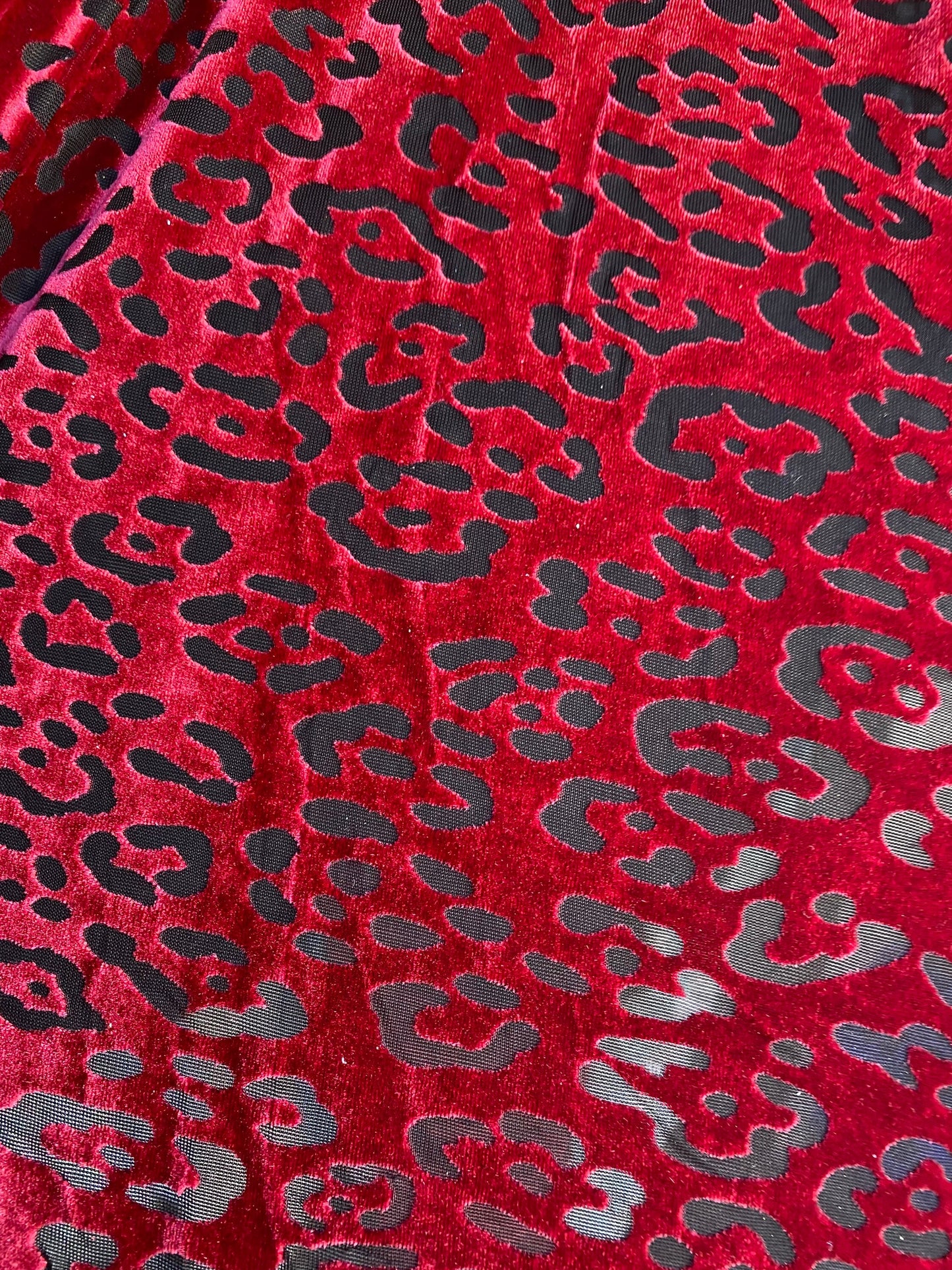 New burnout velvet leopard design black/DK red 4-way stretch 58/60” Sold by the YD. Ships worldwide from Los Angeles California USA.