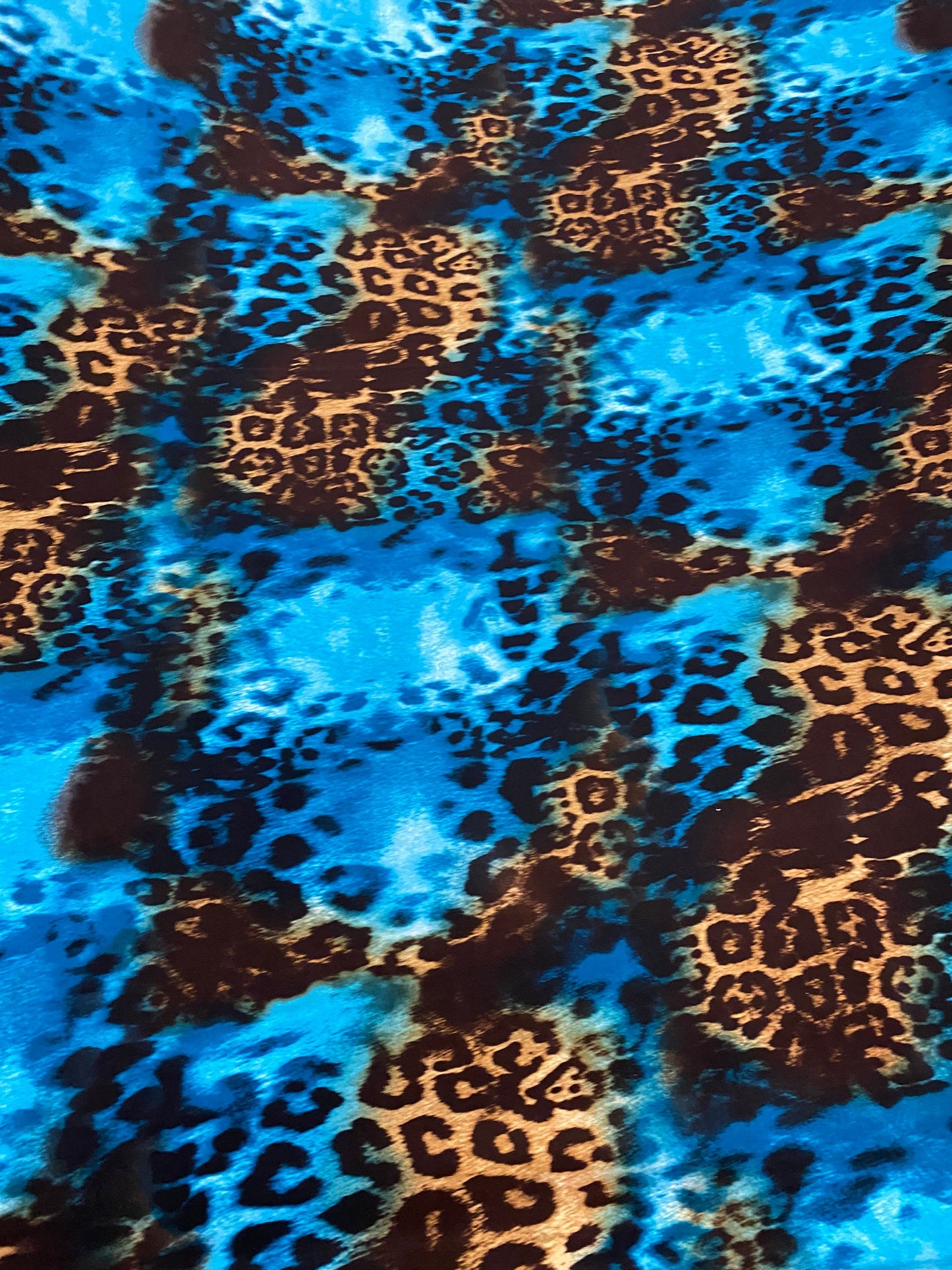 New exotic leopard design teal/brown print on poly spandex medium weight 4-way stretch 58/60” Sold by the YD. Ships worldwide from L.A CA.