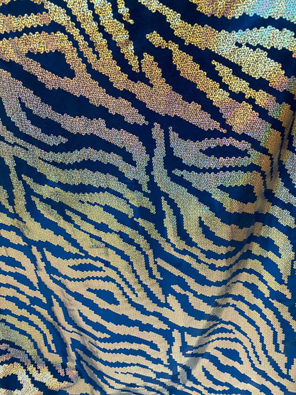 New zebra design sapphire/silver hologram metallic poly spandex with foggy foil all over 4-way stretch 58/60” Sold by the YD.