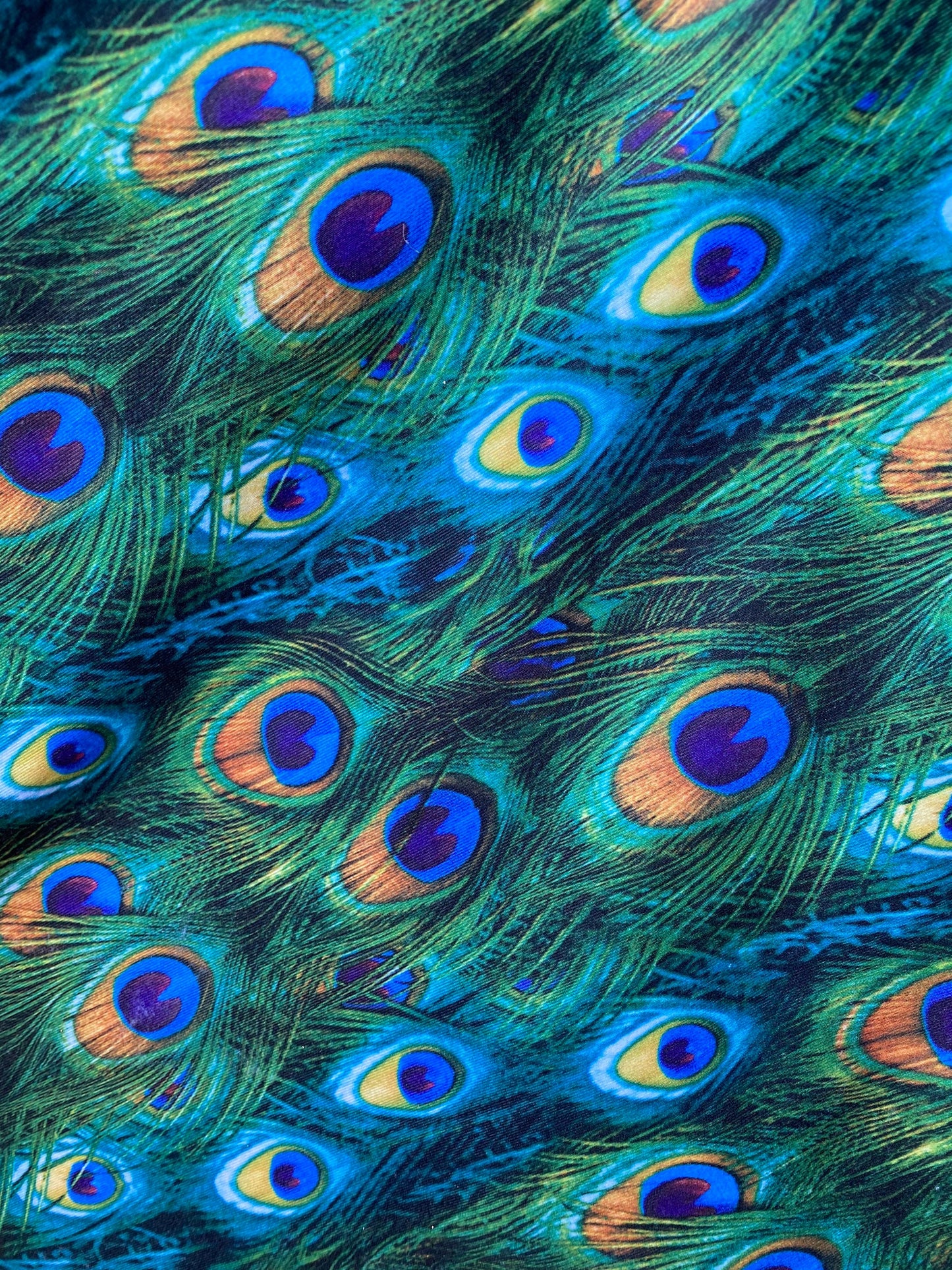 Peacock design print of great quality of nylon spandex 4-way stretch 58/60” Sold by the YD. Ships worldwide from Los Angeles California USA.
