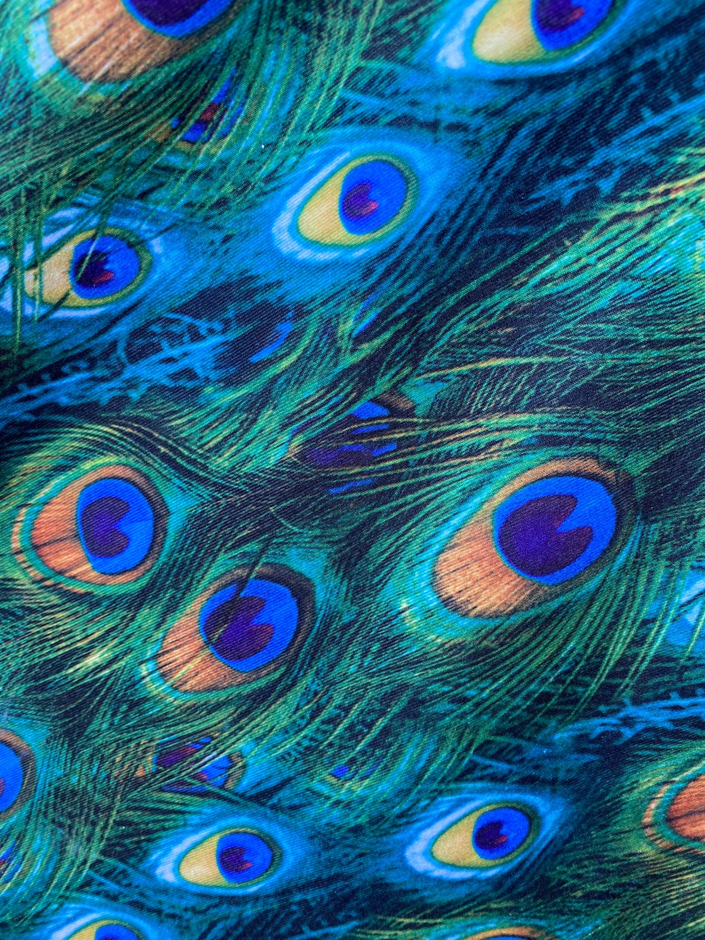 Peacock design print of great quality of nylon spandex 4-way stretch 58/60” Sold by the YD. Ships worldwide from Los Angeles California USA.
