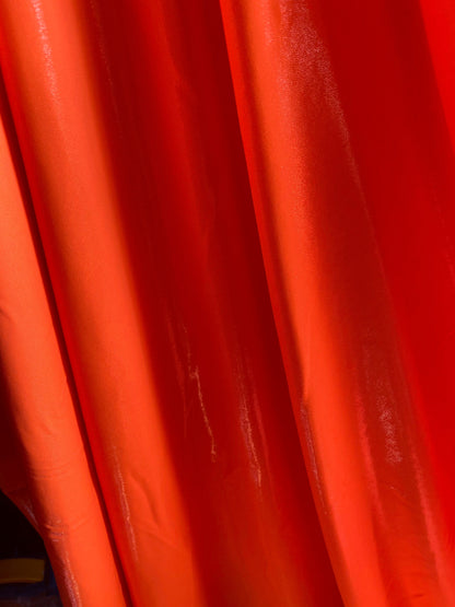 Neon Orange foggy foil nylon spandex 4-way stretch 58/60” Sold by the YD. Ships worldwide from Los Angeles California USA.