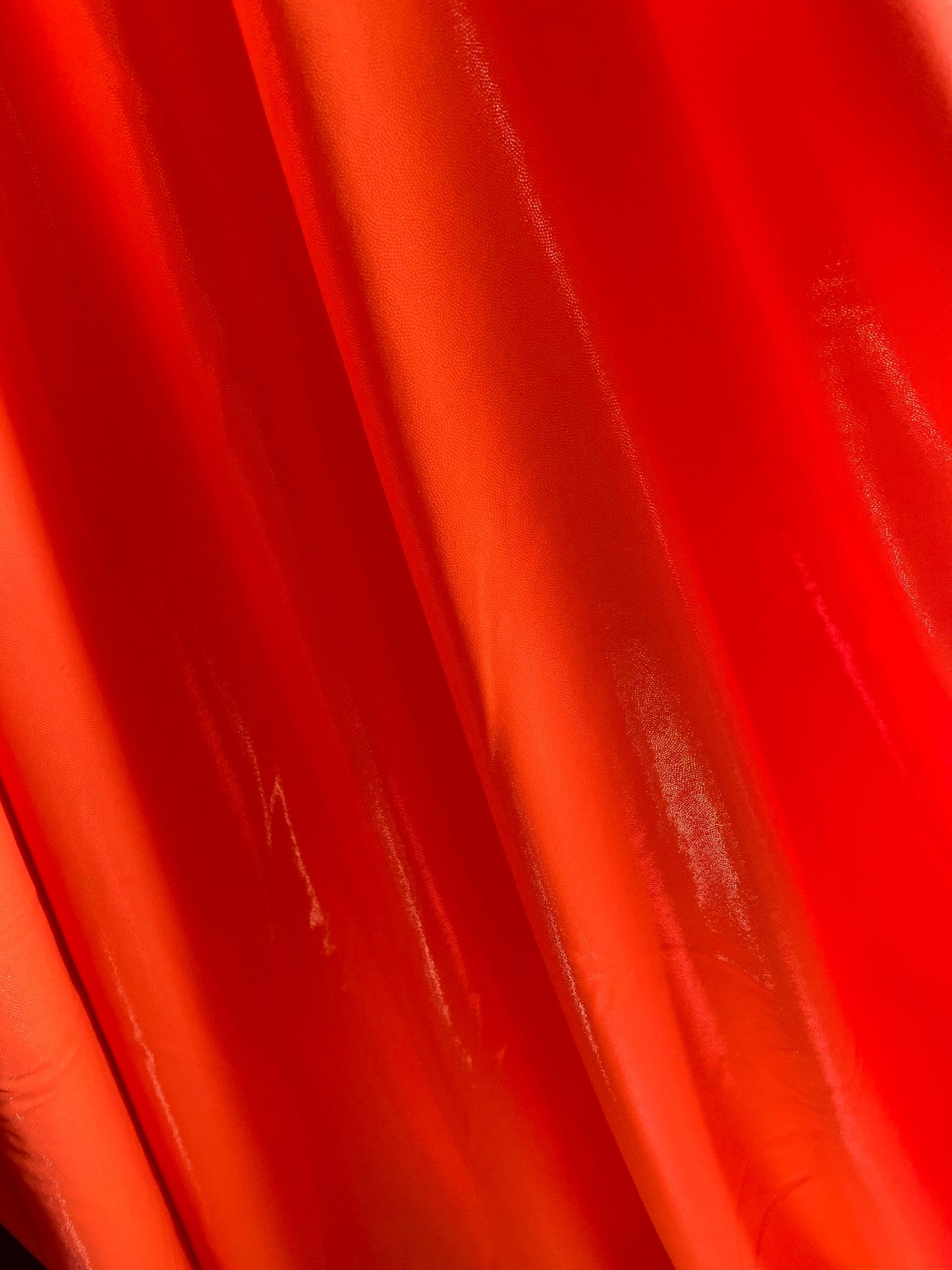 Neon Orange foggy foil nylon spandex 4-way stretch 58/60” Sold by the YD. Ships worldwide from Los Angeles California USA.