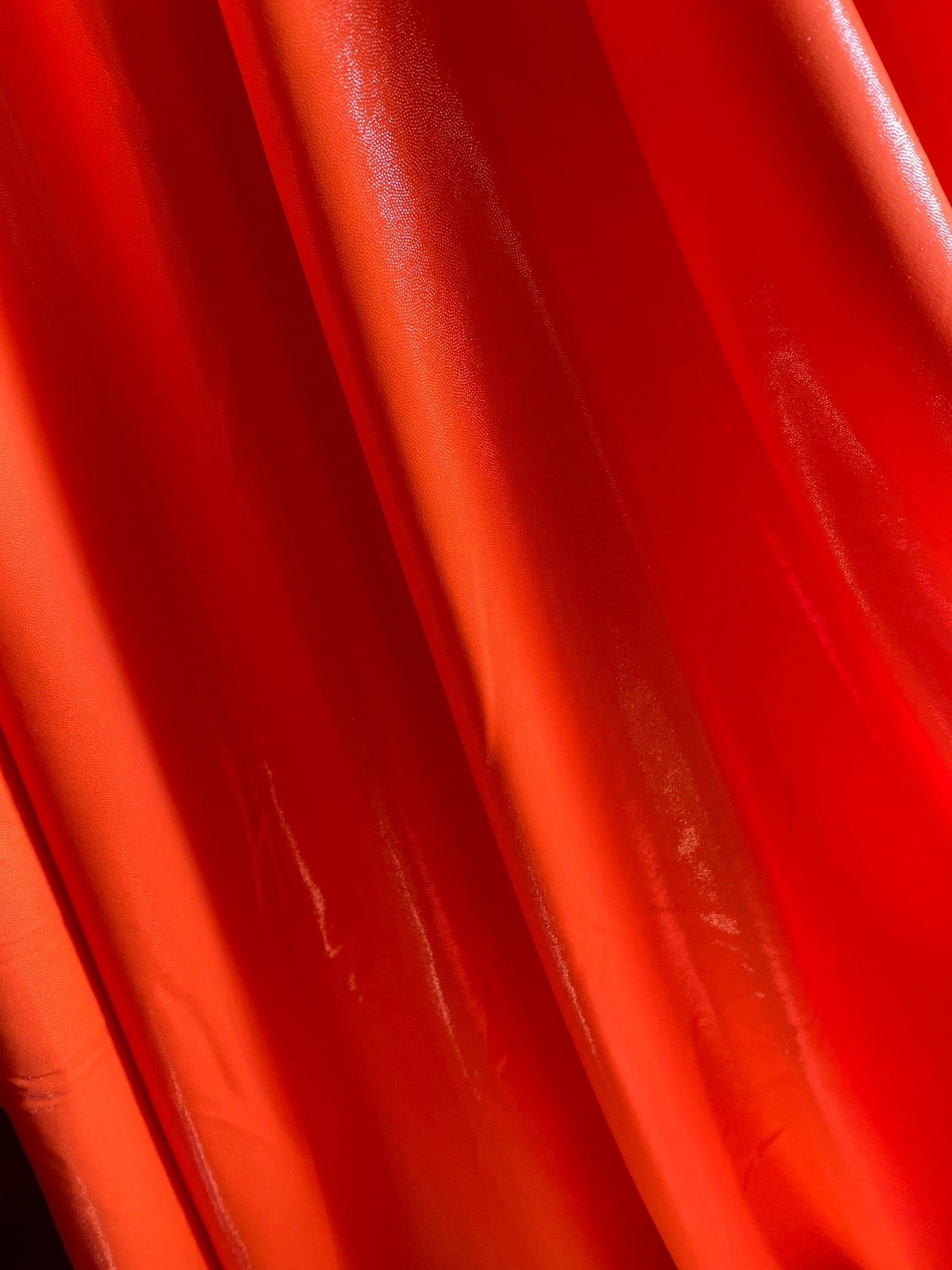 Neon Orange foggy foil nylon spandex 4-way stretch 58/60” Sold by the YD. Ships worldwide from Los Angeles California USA.