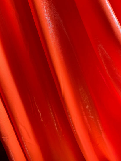 Neon Orange foggy foil nylon spandex 4-way stretch 58/60” Sold by the YD. Ships worldwide from Los Angeles California USA.