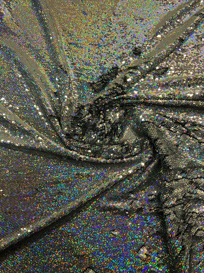 New hologram silver/silver reversible flip up sequins on spandex base 2-way stretch 58/60” Sold by the YD. Ships worldwide from Los Angeles