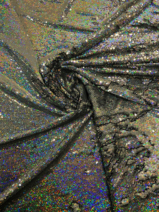 New hologram silver/silver reversible flip up sequins on spandex base 2-way stretch 58/60” Sold by the YD. Ships worldwide from Los Angeles