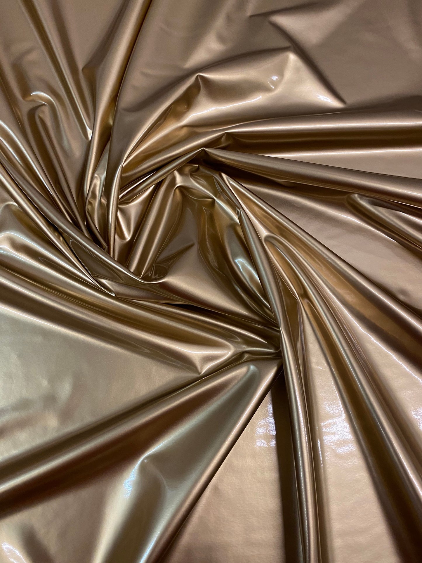 New latex gold shining 4-way stretch 58/60” Sold by the YD. Ships worldwide from Los Angeles California USA.