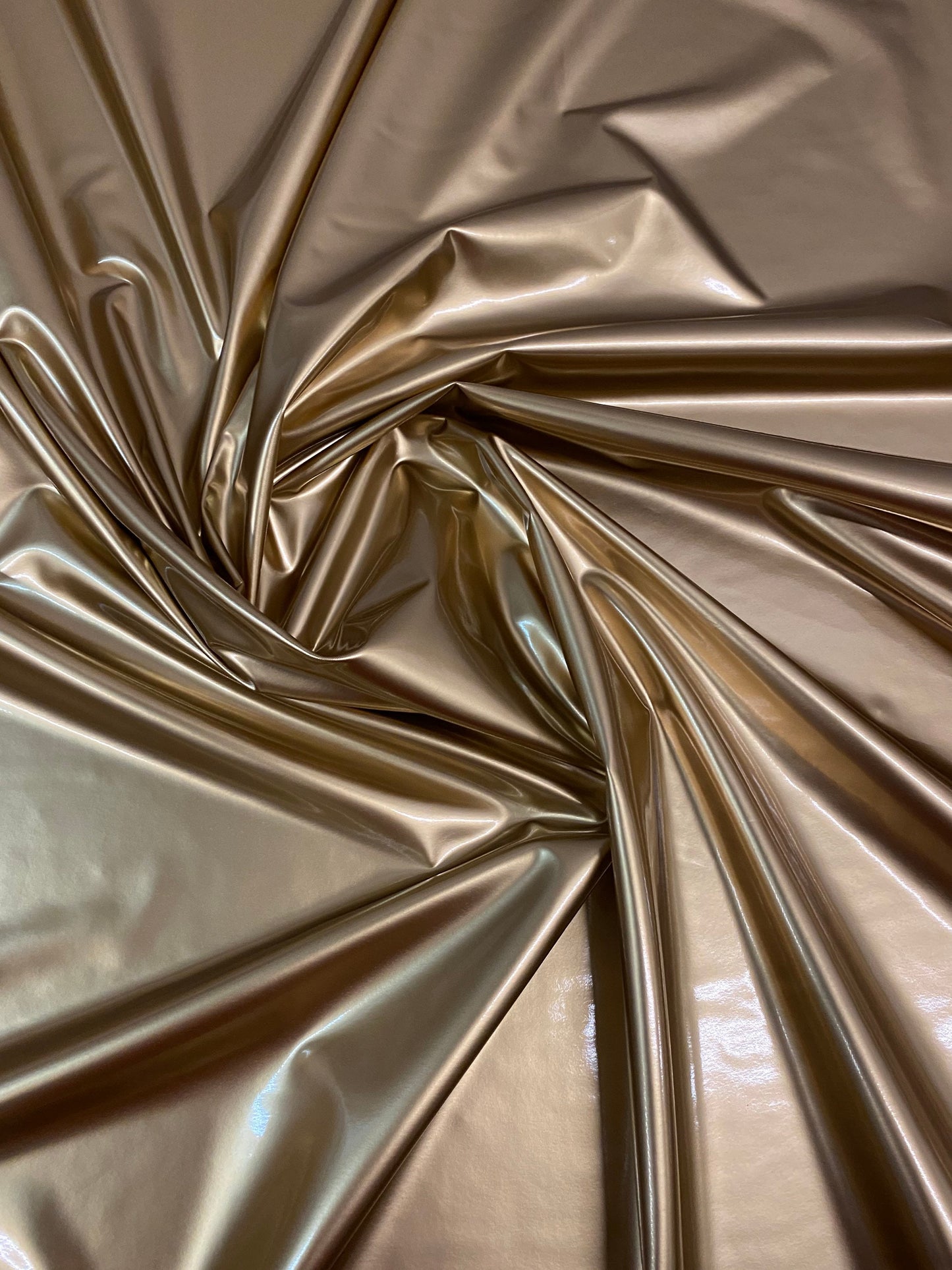 New latex gold shining 4-way stretch 58/60” Sold by the YD. Ships worldwide from Los Angeles California USA.