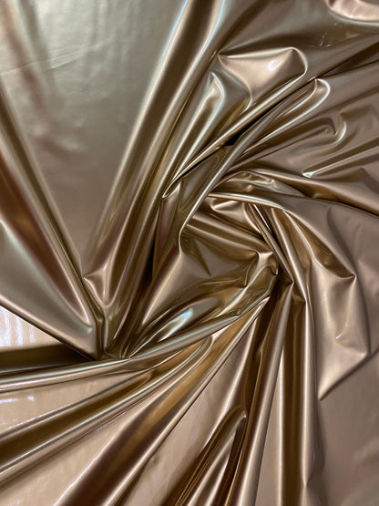 New latex gold shining 4-way stretch 58/60” Sold by the YD. Ships worldwide from Los Angeles California USA.