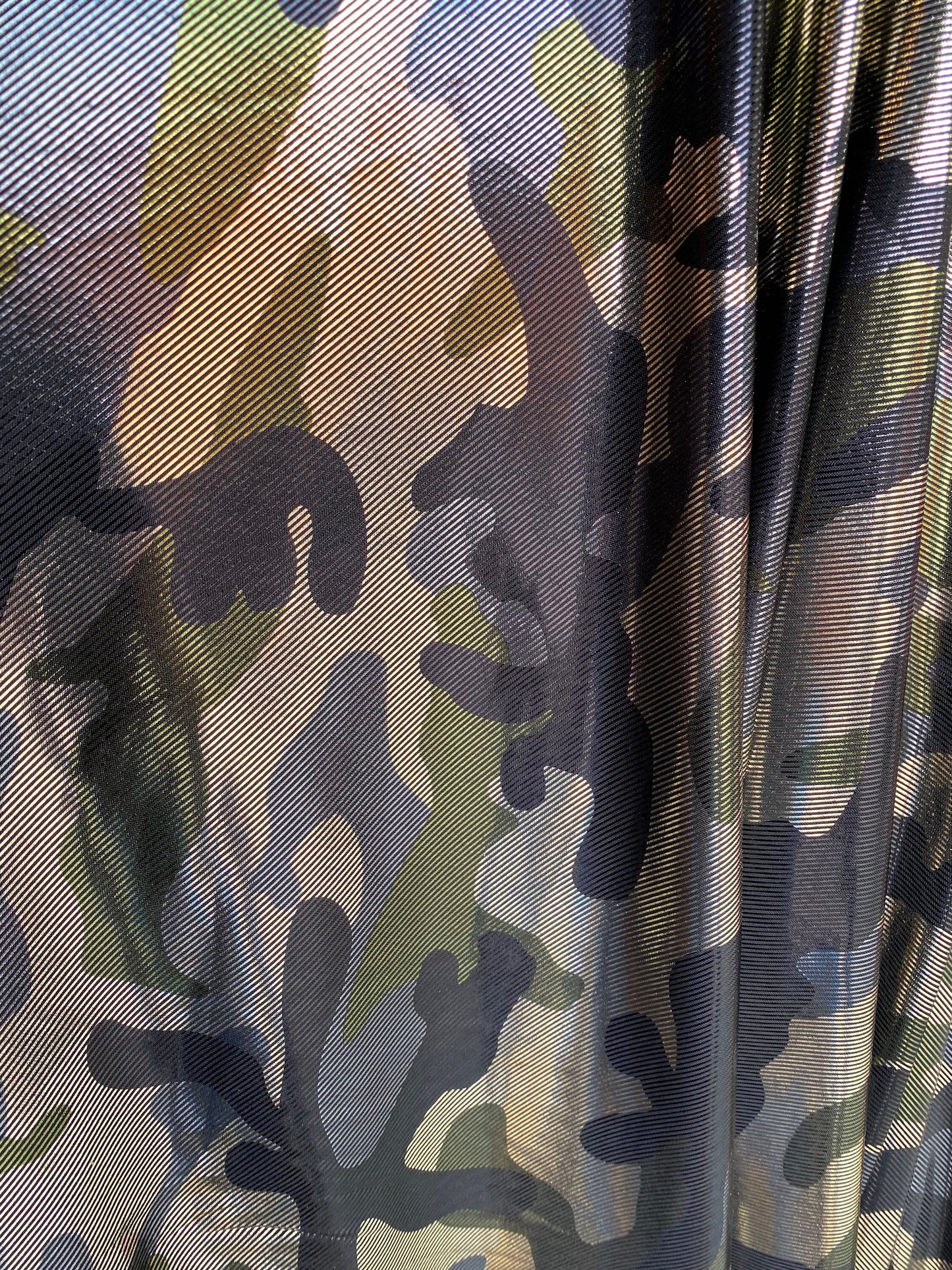 Camouflage army color metallic nylon spandex 4-way stretch 58/60” Sold by the YD. Ships worldwide from Los Angeles California USA.