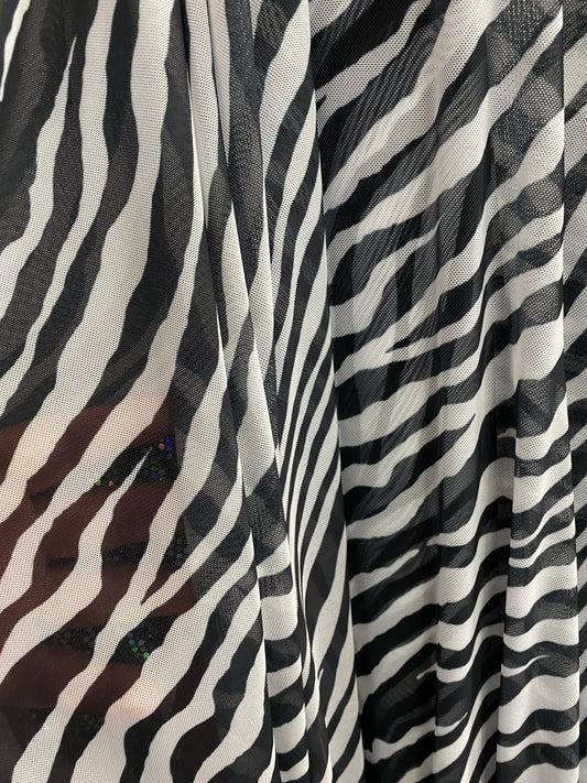 Zebra design exotic print on good quality of power mesh 4-way stretch 58/60” Sold by the YD. Ships worldwide from Los Angeles California USA