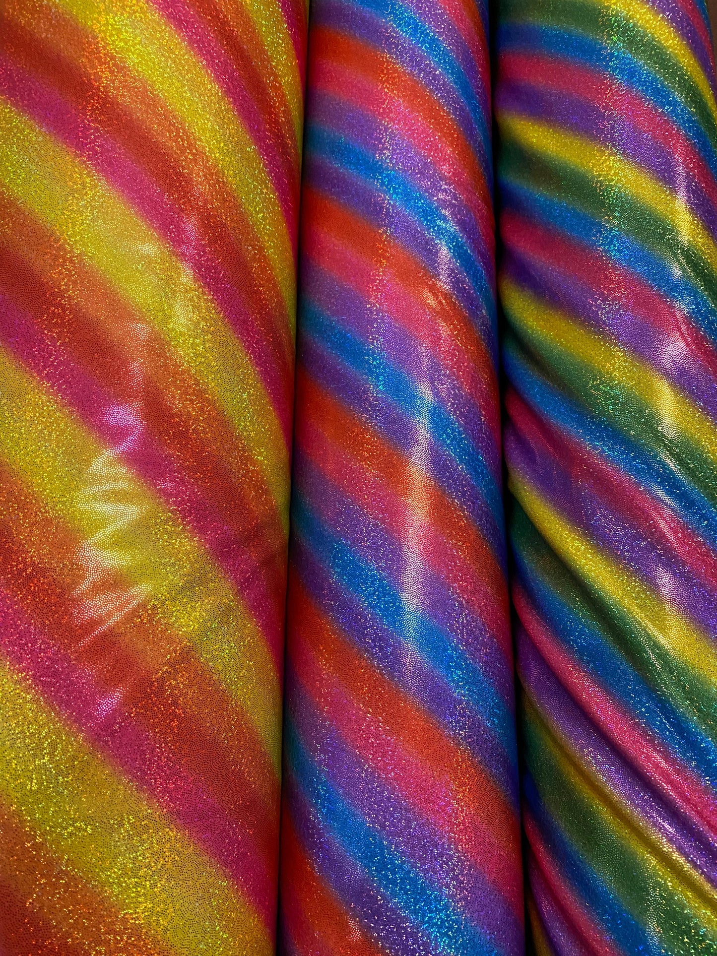 New Luxury rainbow with foggy hologram foil metallic nylon spandex 4-way stretch 58/60” Sold by the YD. Ships worldwide from L.A