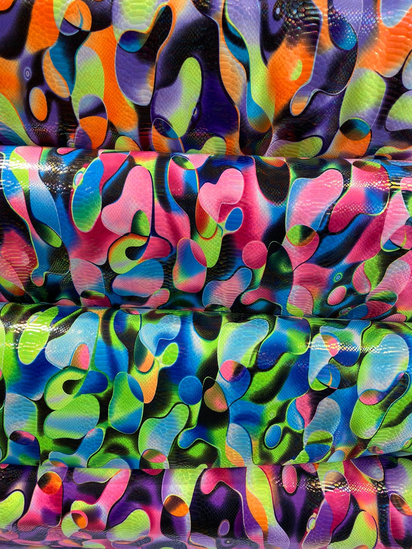 Anaconda snake design print on nylon spandex with iridescent clear foil UV light neon colors it glows in the dark 4-way stretch 58/60” Wide