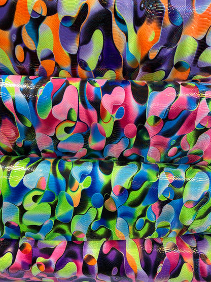 Anaconda snake design print on nylon spandex with iridescent clear foil UV light neon colors it glows in the dark 4-way stretch 58/60” Wide
