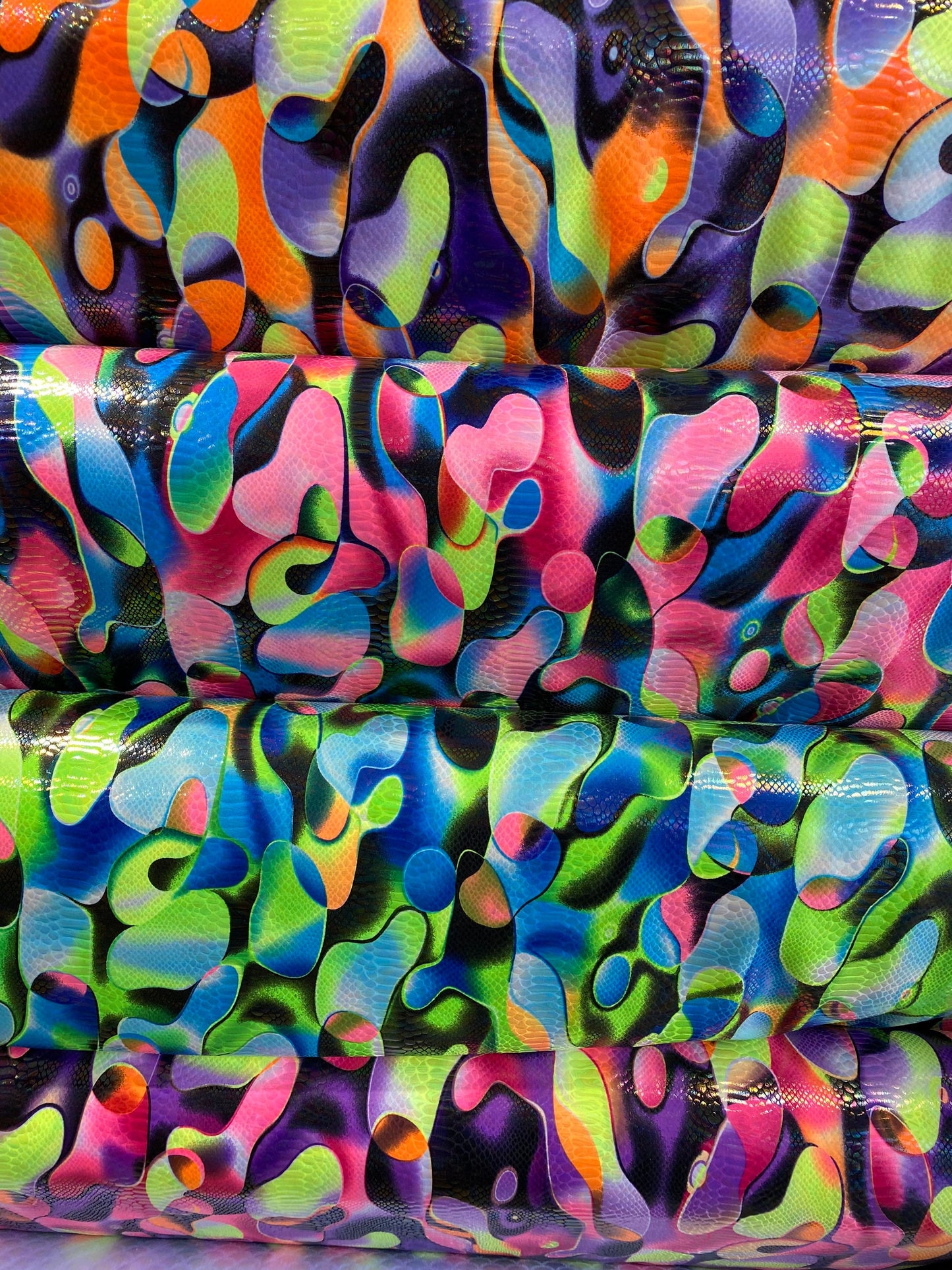 Anaconda snake design print on nylon spandex with iridescent clear foil UV light neon colors it glows in the dark 4-way stretch 58/60” Wide
