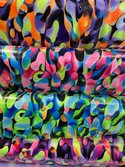 Anaconda snake design print on nylon spandex with iridescent clear foil UV light neon colors it glows in the dark 4-way stretch 58/60” Wide