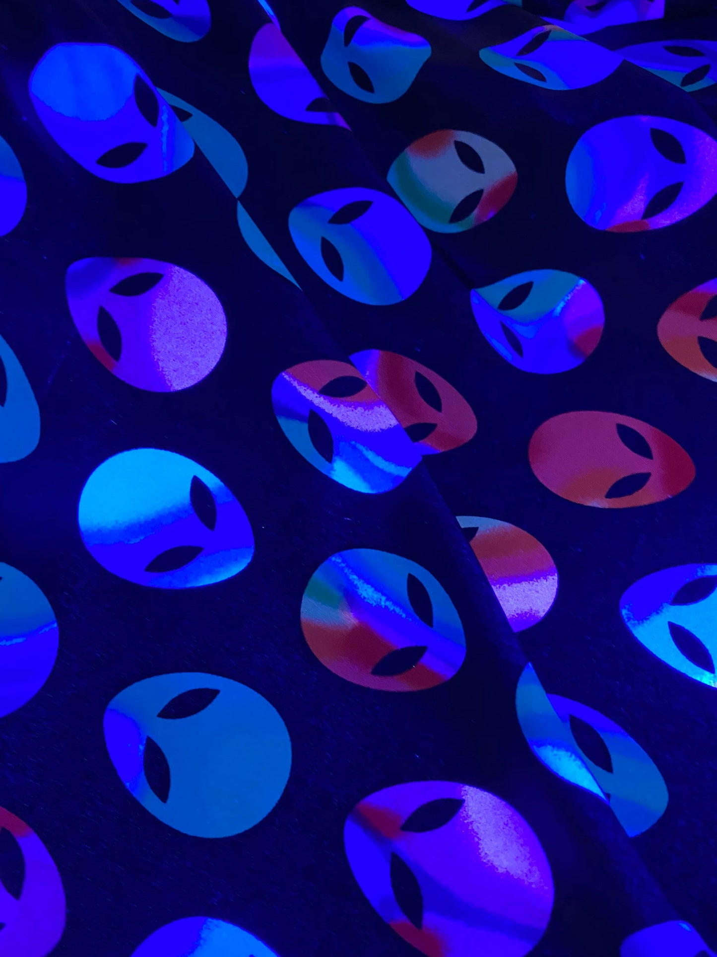 Nylon spandex Alien design it glows in the dark 4way stretch 58/60" sold by the yd. Ships worldwide from Los Angeles California USA