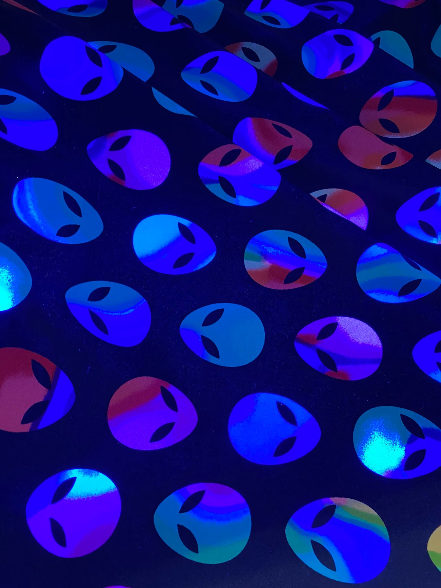 Nylon spandex Alien design it glows in the dark 4way stretch 58/60" sold by the yd. Ships worldwide from Los Angeles California USA