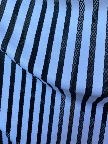 New stripes design nylon spandex with mesh stripes 4-way stretch 58-60” sold by the YD. Ships worldwide from Los Angeles California USA.