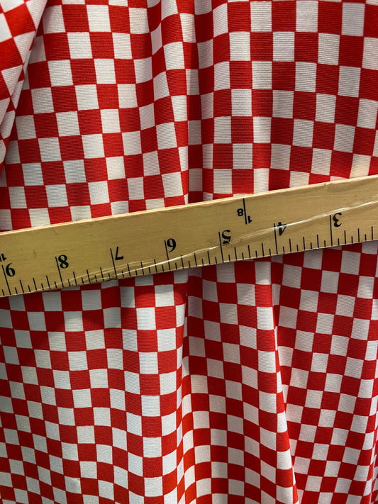 New small Chequers design red/white print on poly spandex 4-way stretch 58/60” Sold by the YD. Ships worldwide from Los Angeles California