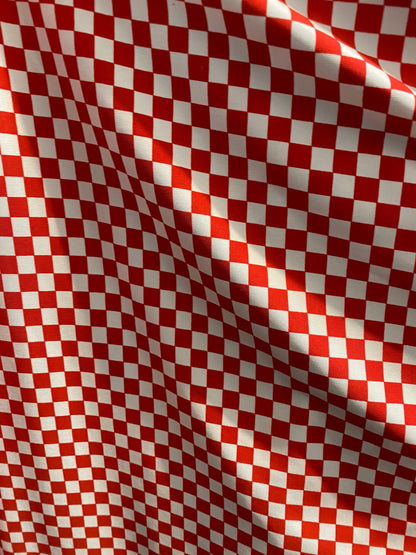 New small Chequers design red/white print on poly spandex 4-way stretch 58/60” Sold by the YD. Ships worldwide from Los Angeles California