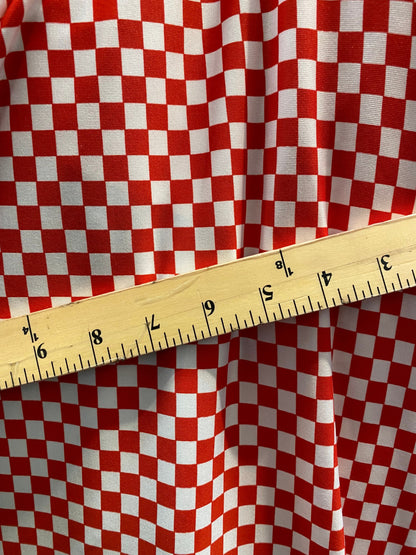 New small Chequers design red/white print on poly spandex 4-way stretch 58/60” Sold by the YD. Ships worldwide from Los Angeles California