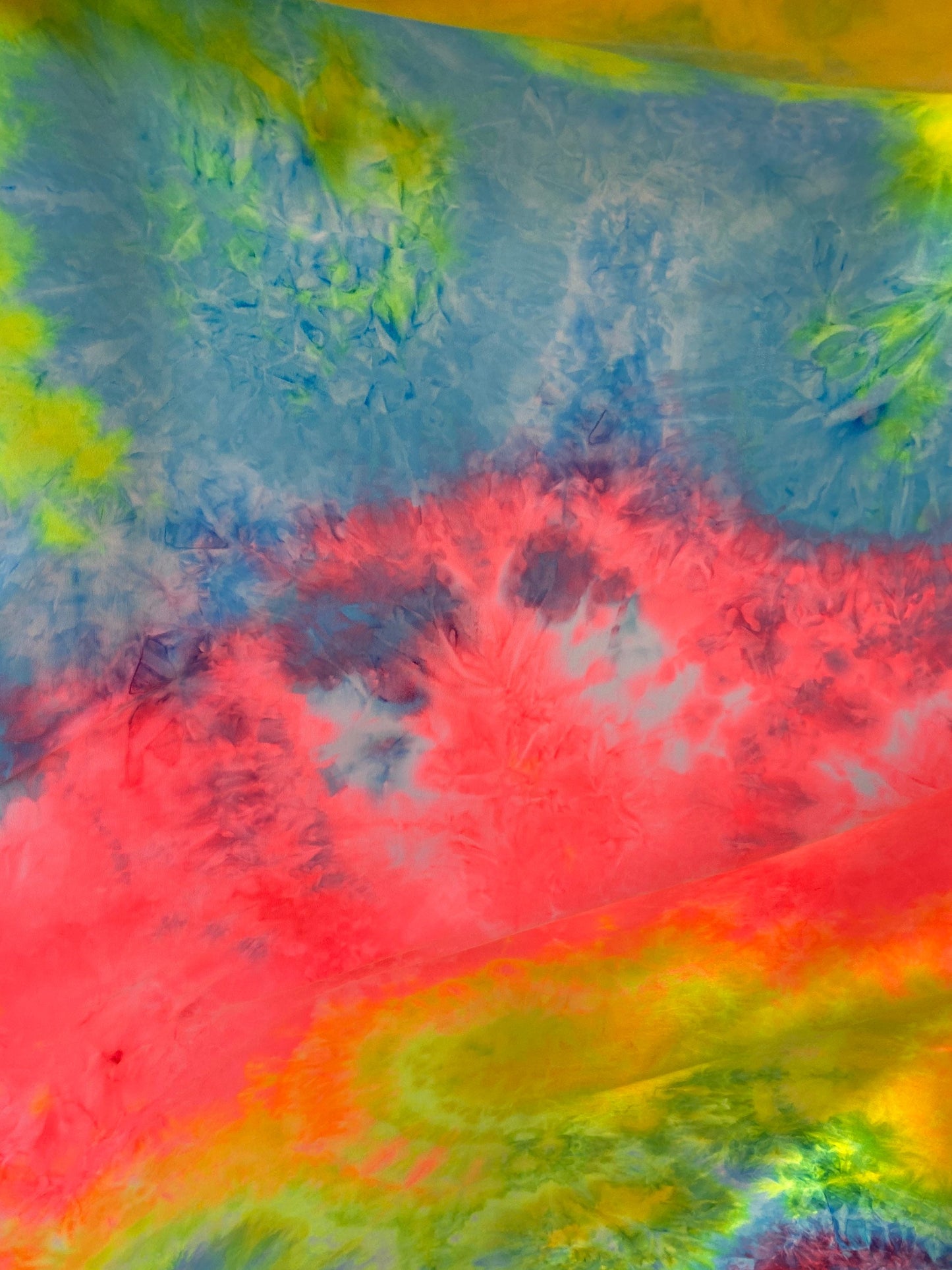 New tie dye rainbow poly spandex medium weight 4-way stretch 58/60” Sold by the YD. Ships worldwide from Los Angeles California USA.