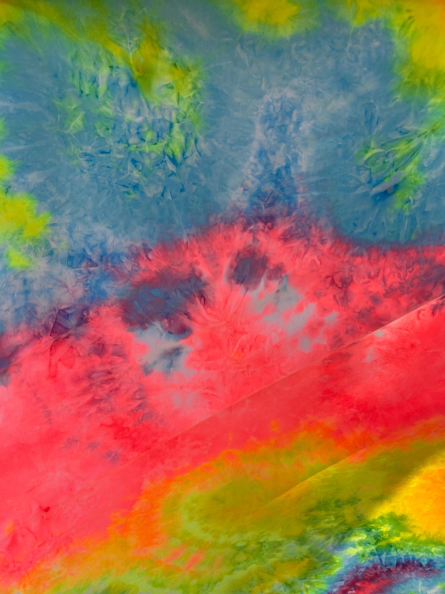 New tie dye rainbow poly spandex medium weight 4-way stretch 58/60” Sold by the YD. Ships worldwide from Los Angeles California USA.