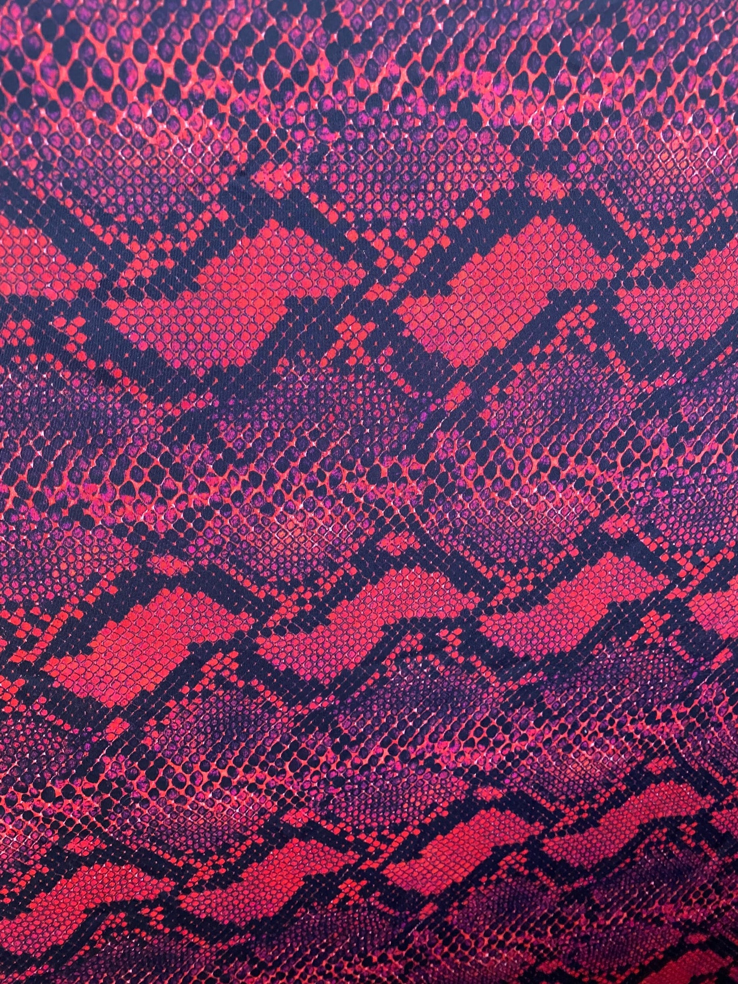 Serpent design Red/black print on nylon spandex 4-way stretch 58/60” Sold  by the YD. Ships worldwide from Los Angeles California USA.