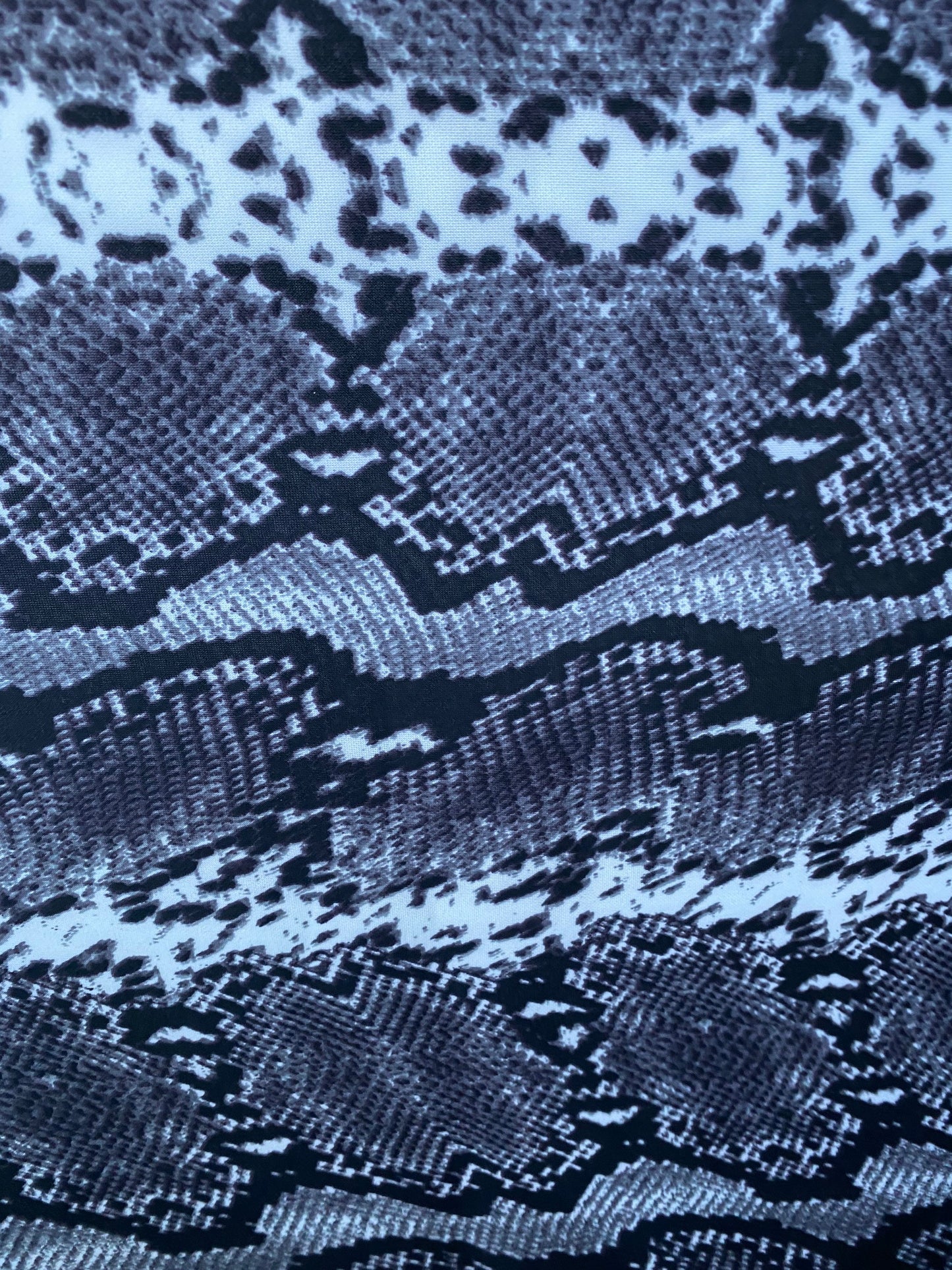 New exotic snake design gray/white/black print on poly techno 2-way stretch medium weight 58/60” Sold by the YD. Ships worldwide