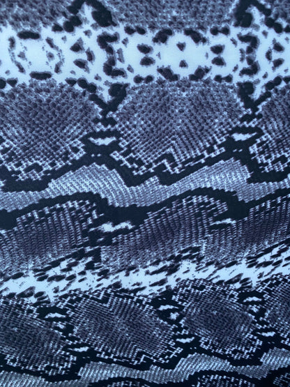 New exotic snake design gray/white/black print on poly techno 2-way stretch medium weight 58/60” Sold by the YD. Ships worldwide