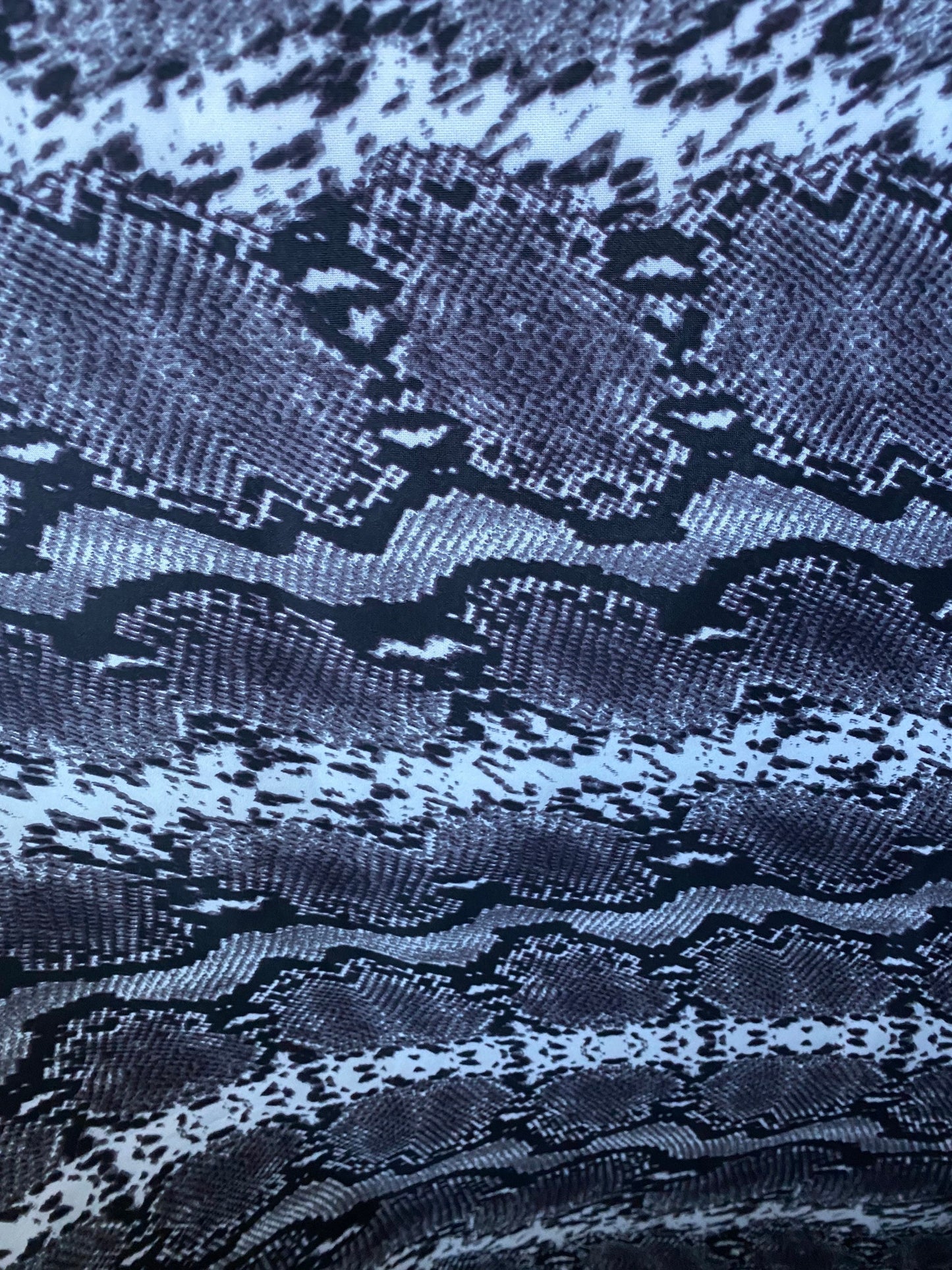 New exotic snake design gray/white/black print on poly techno 2-way stretch medium weight 58/60” Sold by the YD. Ships worldwide