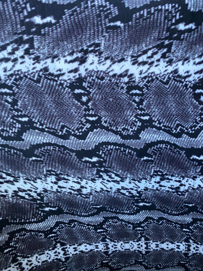 New exotic snake design gray/white/black print on poly techno 2-way stretch medium weight 58/60” Sold by the YD. Ships worldwide