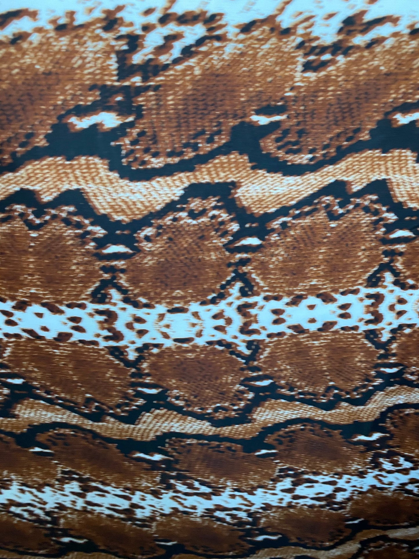 New exotic snake design taupe/black/white print on poly techno 2-way stretch medium weight 58/60” Sold by the YD. Ships worldwide