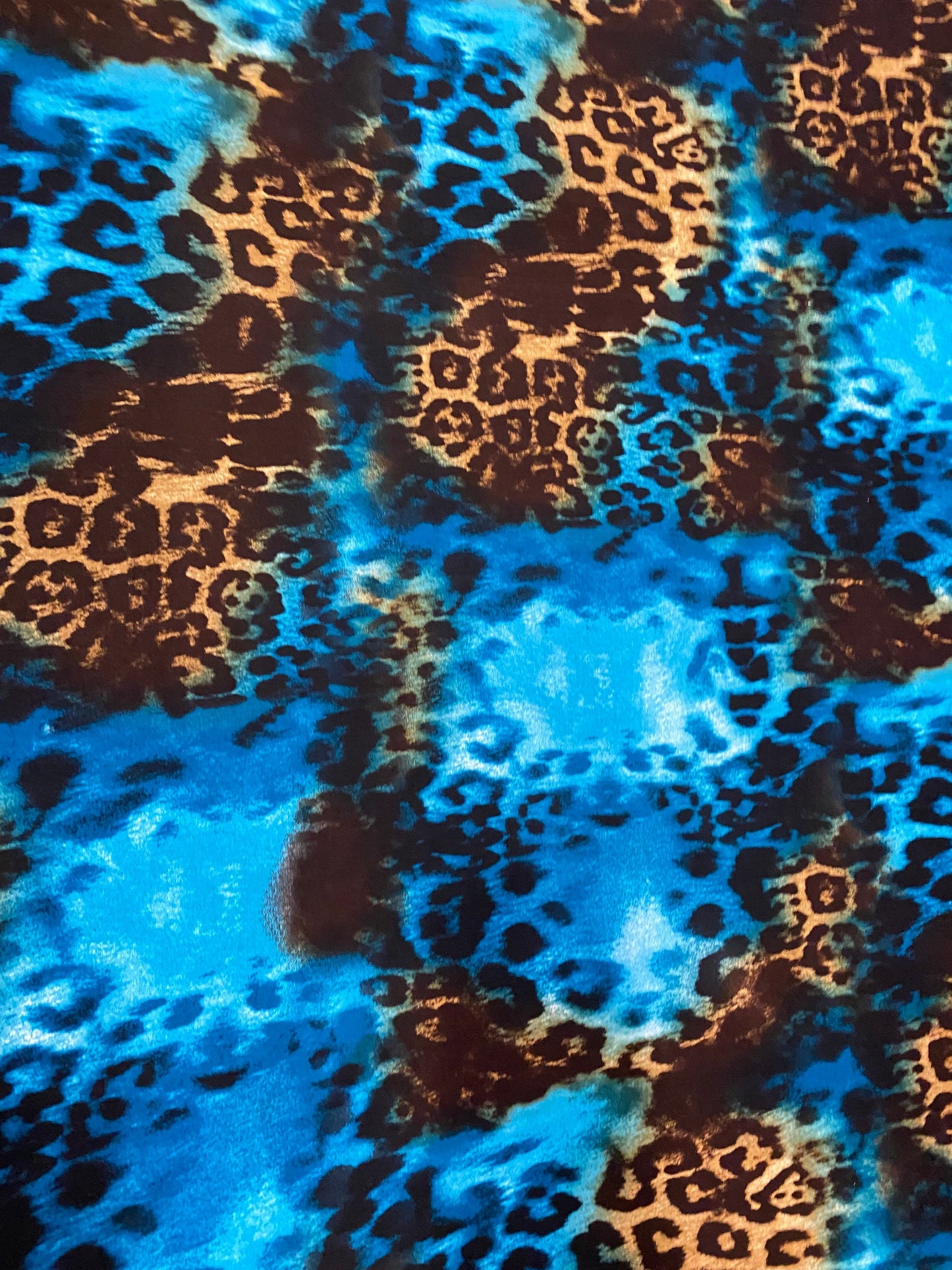 New exotic leopard design teal/brown print on poly spandex medium weight 4-way stretch 58/60” Sold by the YD. Ships worldwide from L.A CA.