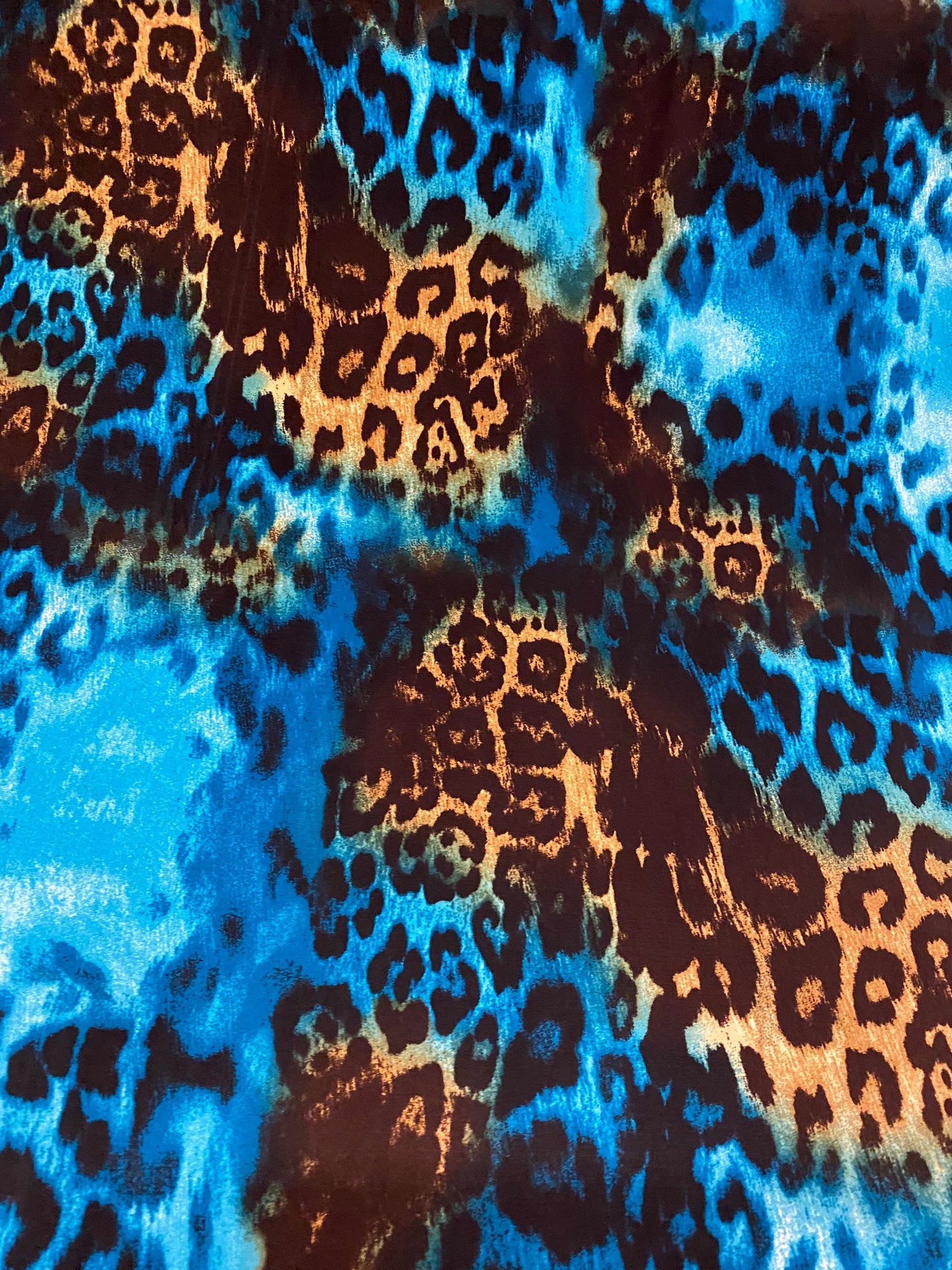 New exotic leopard design teal/brown print on poly spandex medium weight 4-way stretch 58/60” Sold by the YD. Ships worldwide from L.A CA.