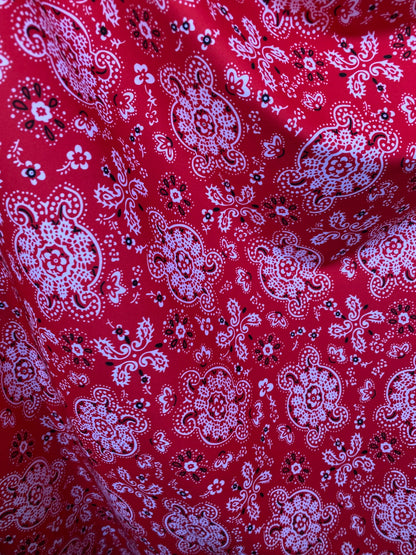Red bandana design print on great quality of brushed poly spandex 4-way stretch medium weight 58/60” Sold by the YD.