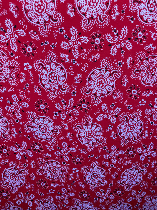 Red bandana design print on great quality of brushed poly spandex 4-way stretch medium weight 58/60” Sold by the YD.