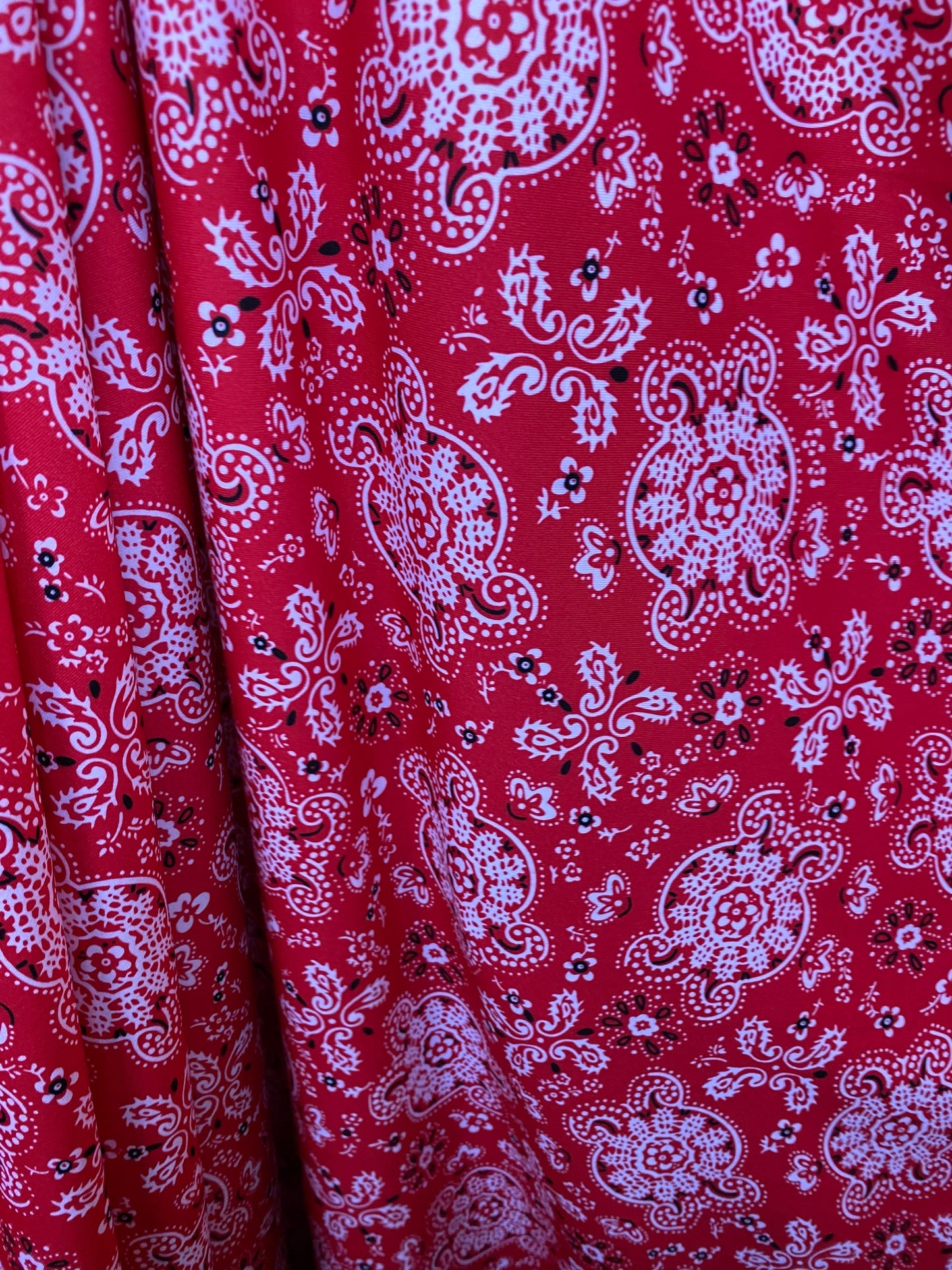 Red bandana design print on great quality of brushed poly spandex 4-way stretch medium weight 58/60” Sold by the YD.